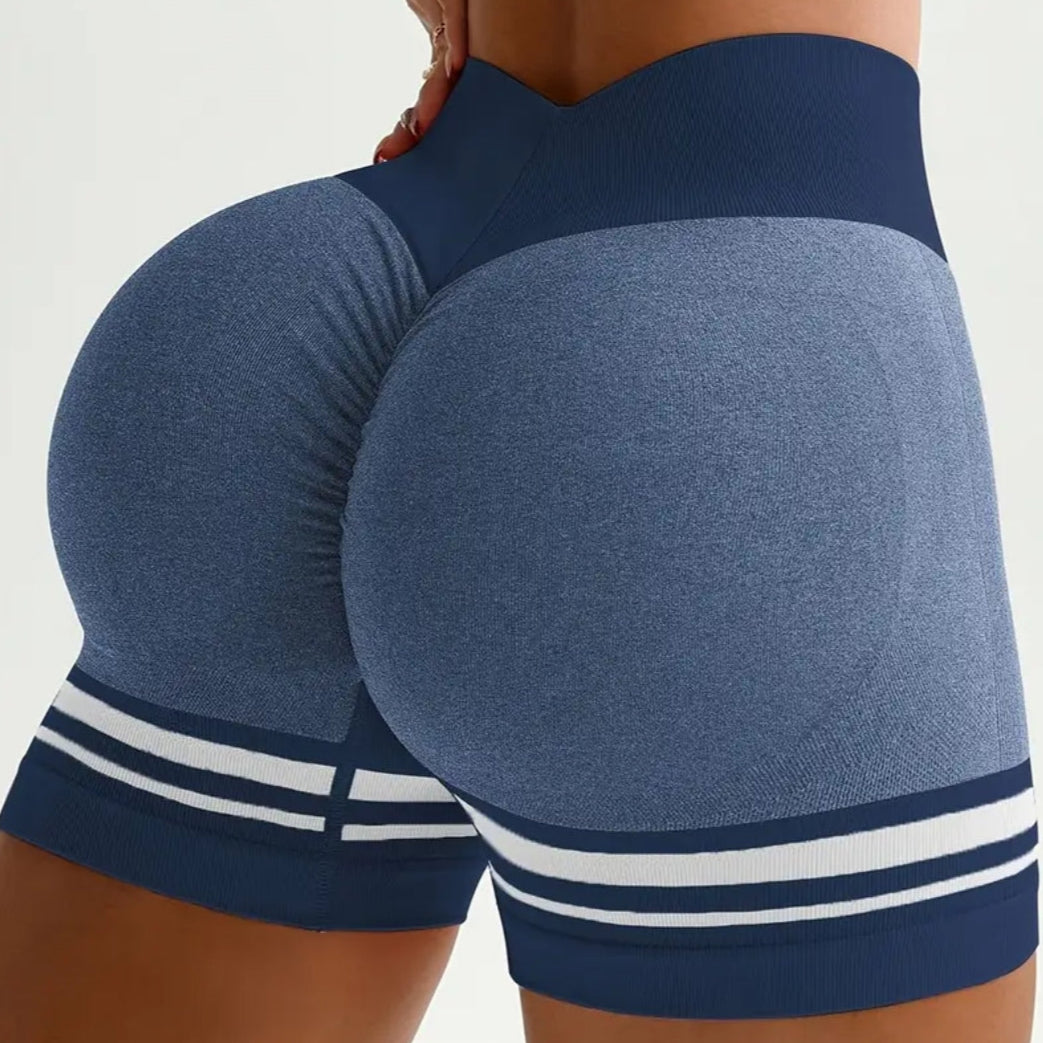 Blue athletic shorts with white stripes on a plain background
