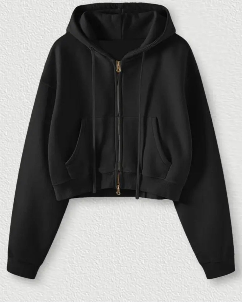Black hoodie on a textured white background