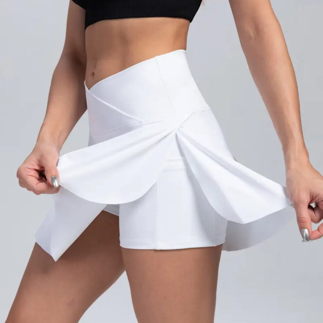 popflex dupe White tennis skirt worn by a person on a plain background