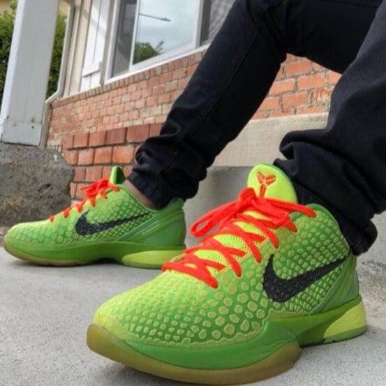 Kobe Grinch Reps – Bright neon green repsneakers on feet