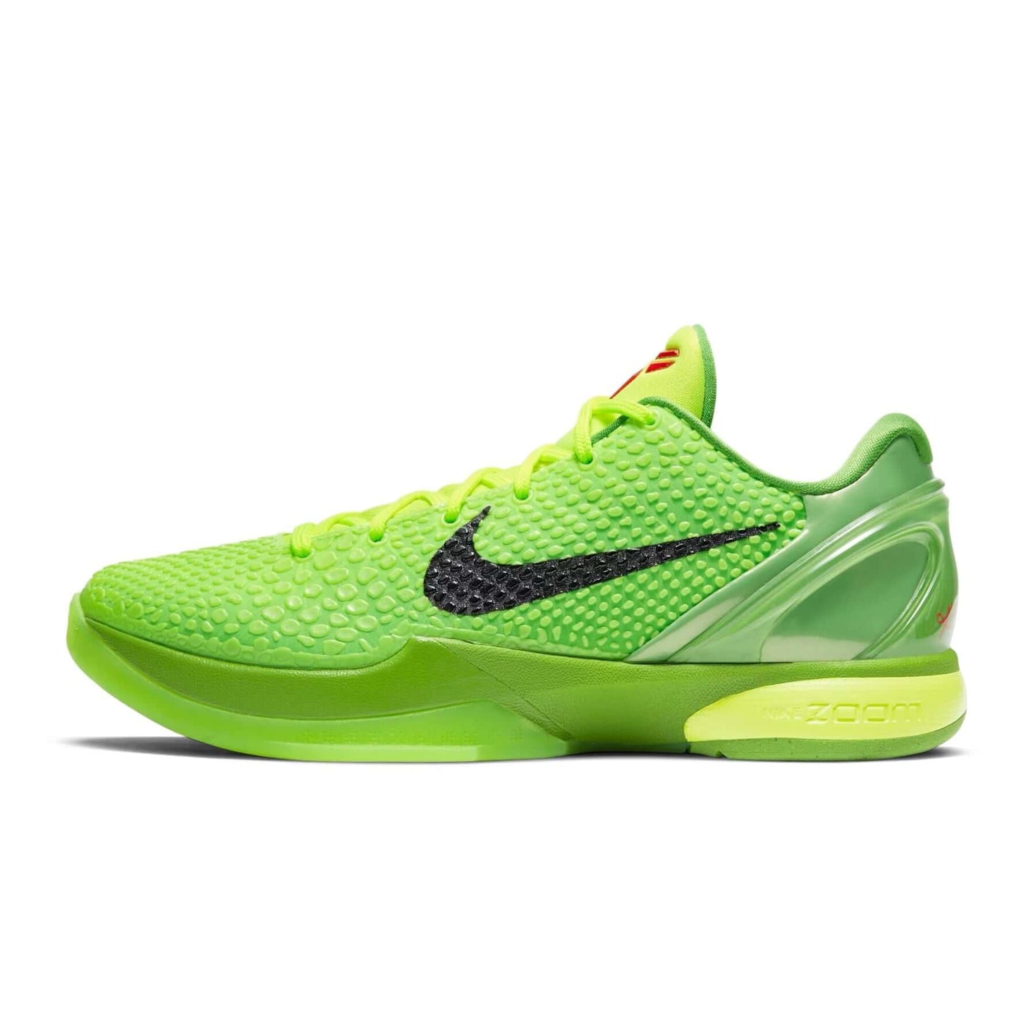 Green Nike sneaker with black swoosh logo on a white background