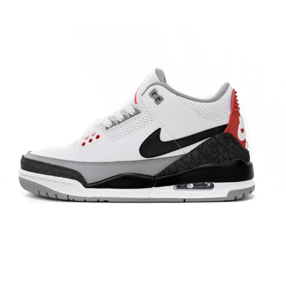 White sneaker with black and red accents on a white background