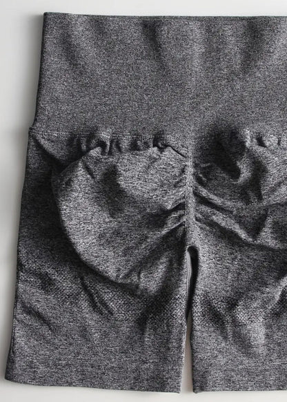 Gray leggings with a textured pattern on a white background
