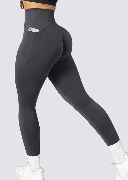 Black leggings with a pocket on a light gray background