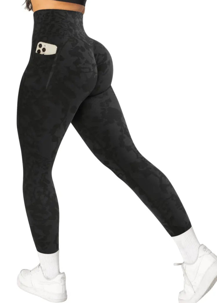 Black leggings with a pocket on a white background
