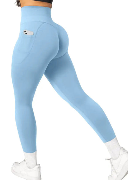 Light blue leggings worn by a person on a white background