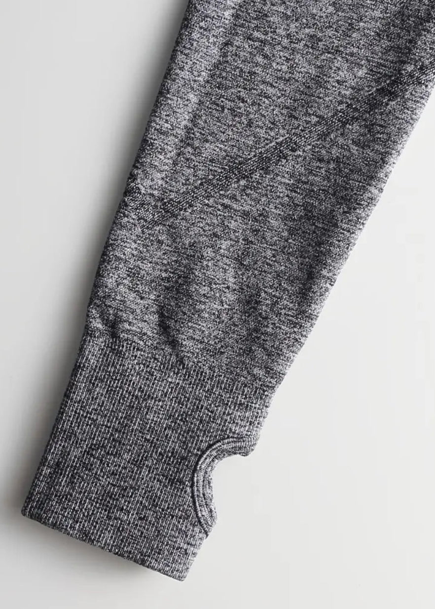 Gray knitted sleeve on a light gray background