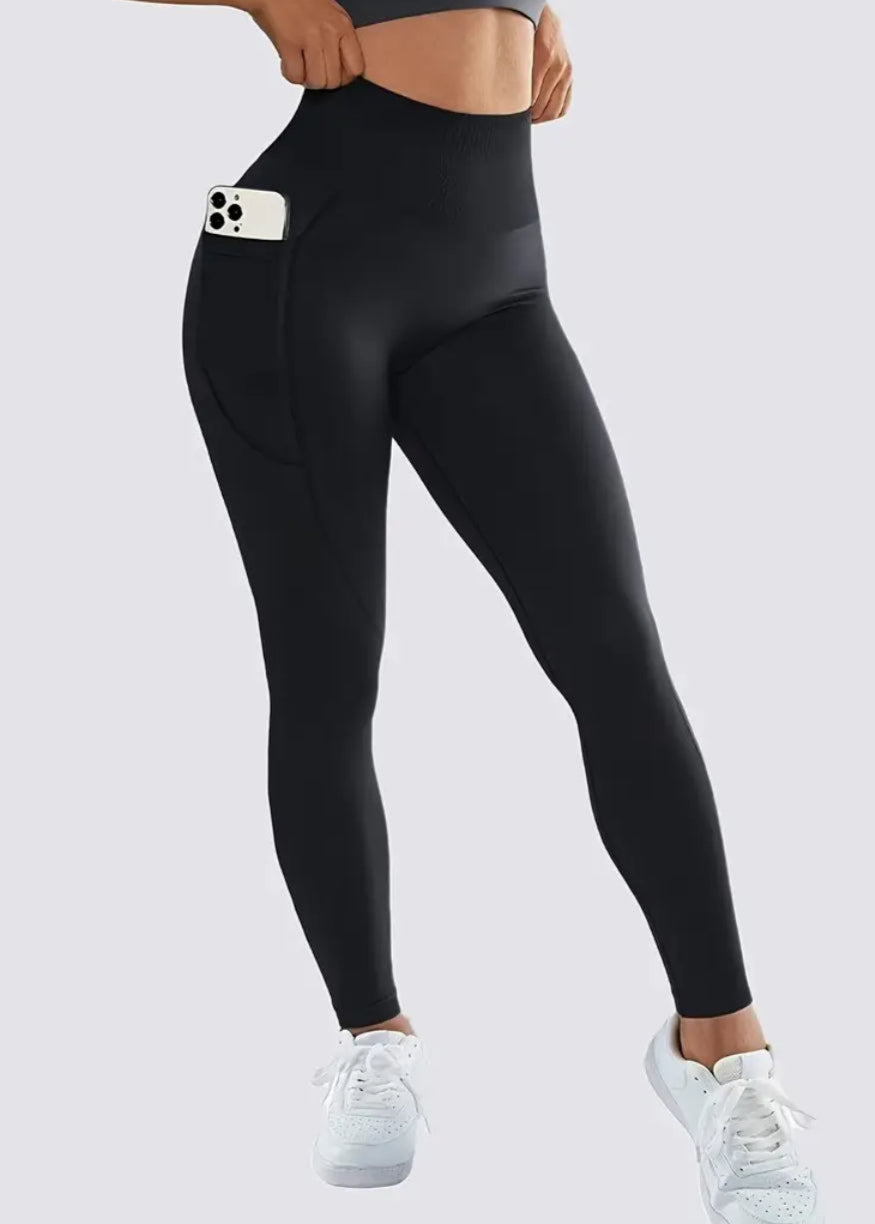 Black leggings with a pocket on a white background