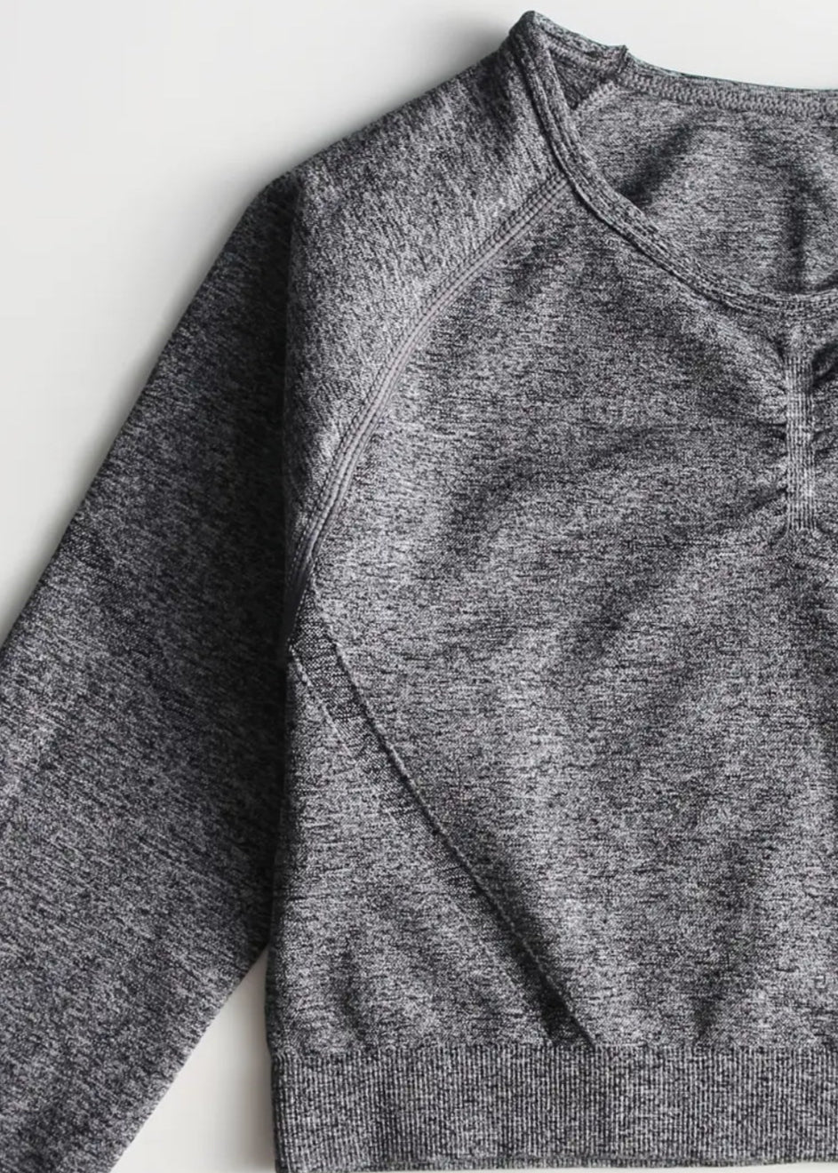 Gray heathered long-sleeve shirt on a white background