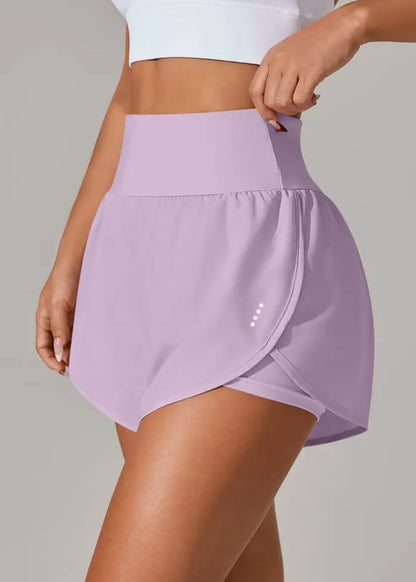 Person wearing a light purple athletic skirt on a plain background