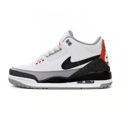 White sneaker with black and red accents on a white background